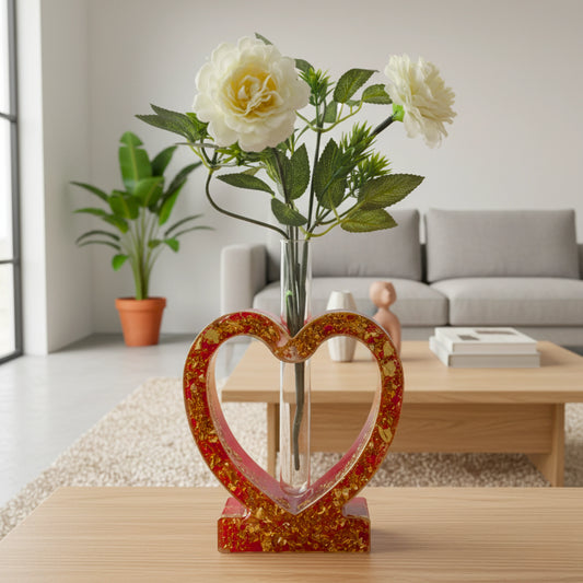 Heart-shaped vase with flowers on a table in a living room