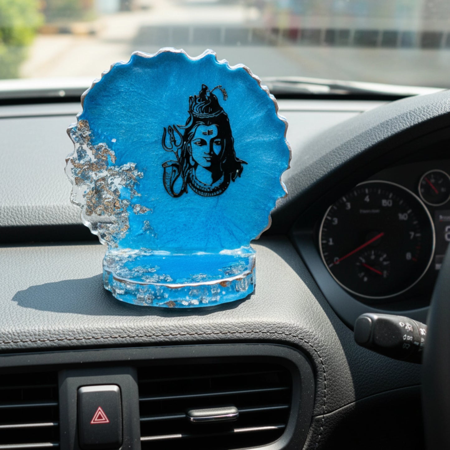 featuring lord siva in a car dashboard showpiece in a blue and silver decorative dashboard