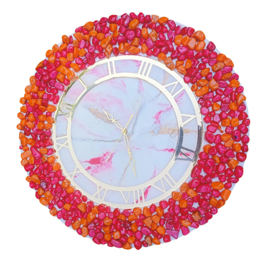 Decorative wall clock with colorful pebble-like border on a white by background by Nandakl Decors
